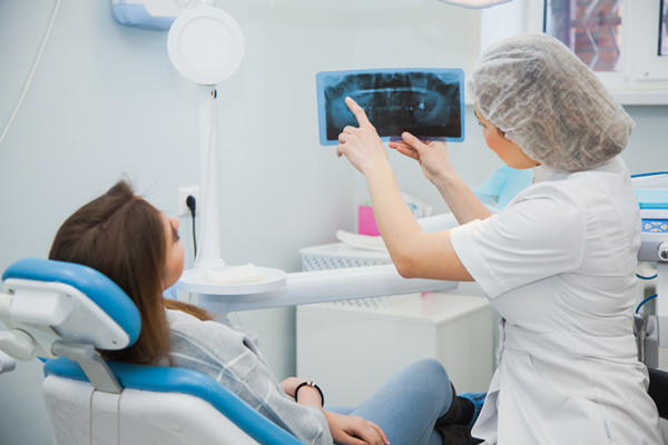 Patient and Doctor chatting about bone grafting at Alexandra Garcia, DDS in Houston, TX
